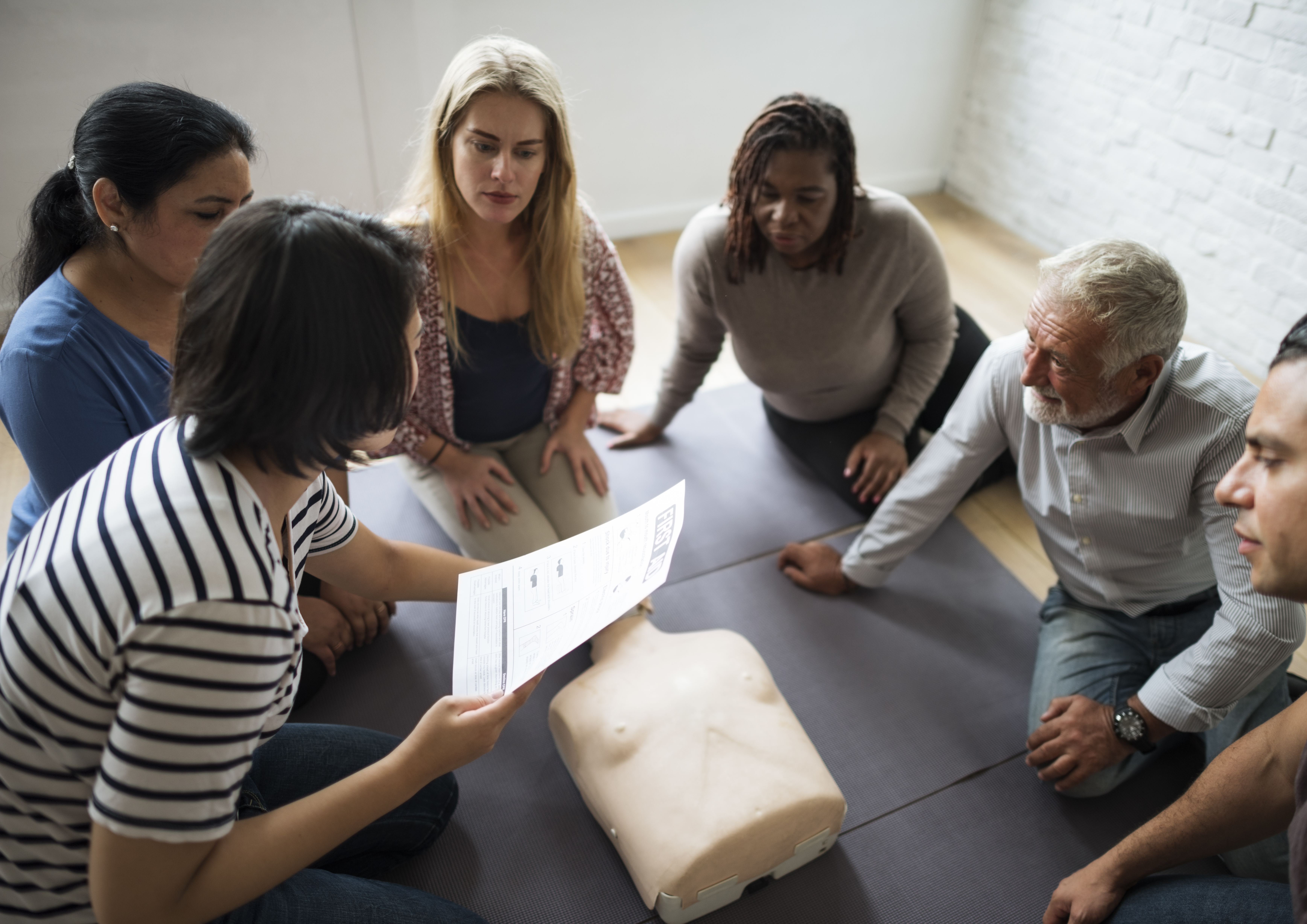 Social care workers attending a professional training session as part of essential care courses in 2026.