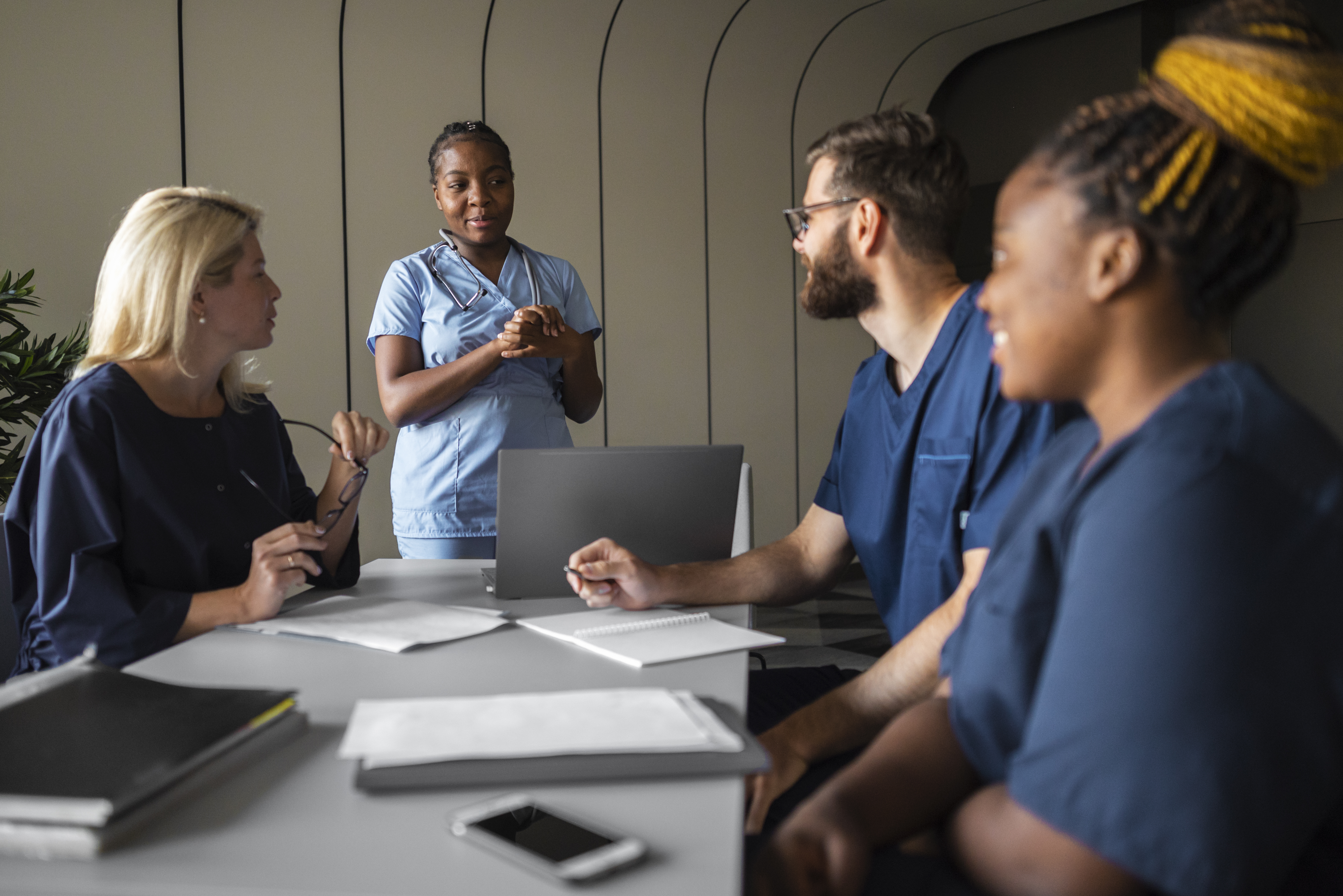 Health professionals sitting in a class and receiving additional training