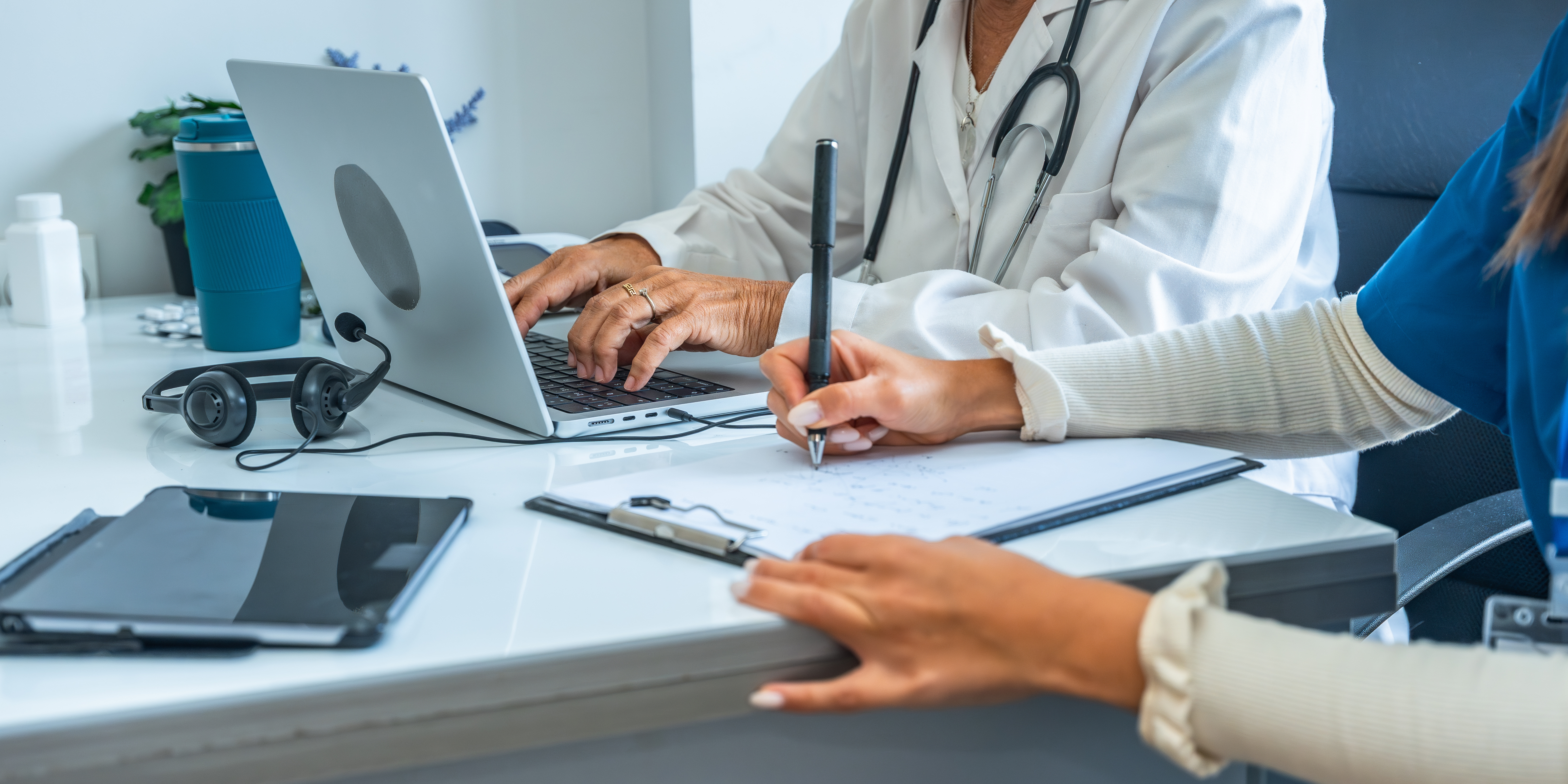 Doctor and Nurse looking through paperwork