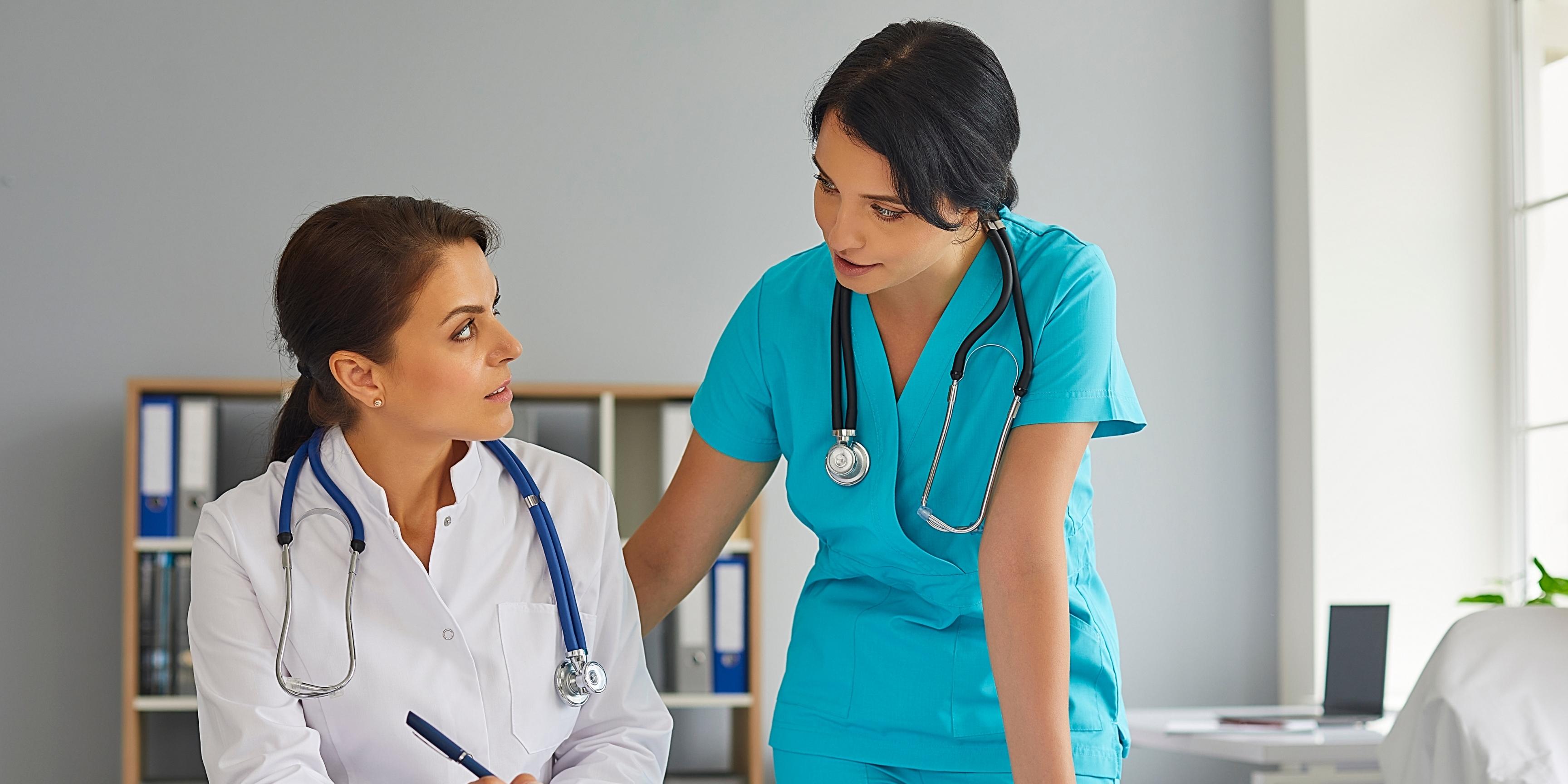 Doctor and Nurse looking through paperwork