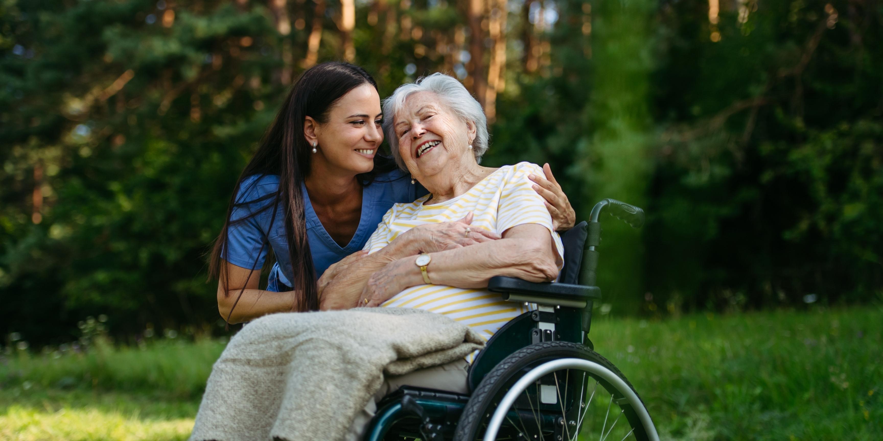 Carer and patient sharing a warm moment while in the park